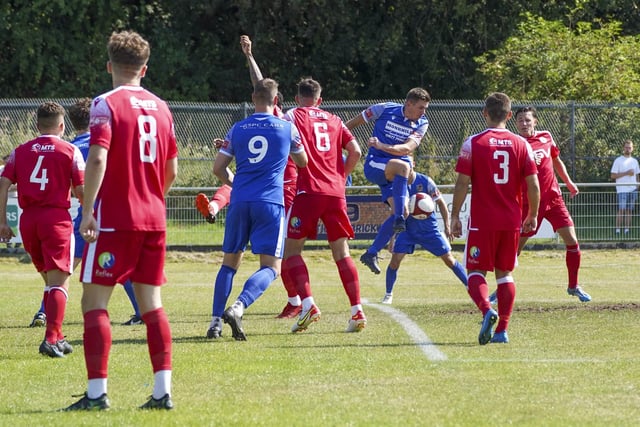 Joe Lumsden gets a shot in to score the first goal for Pontefract Collieries against Grimsby Borough. Picture: Scott Merrylees