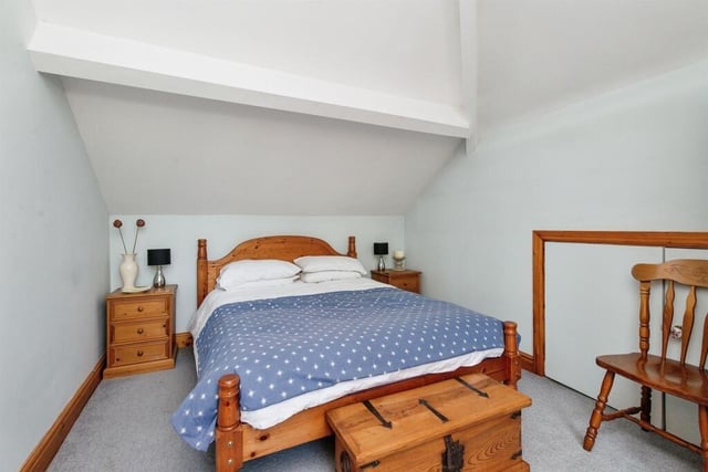 Bedroom two can be accessed by the wine cellar and features a double glazed door to the yard, spotlights and a wall hung radiator.
