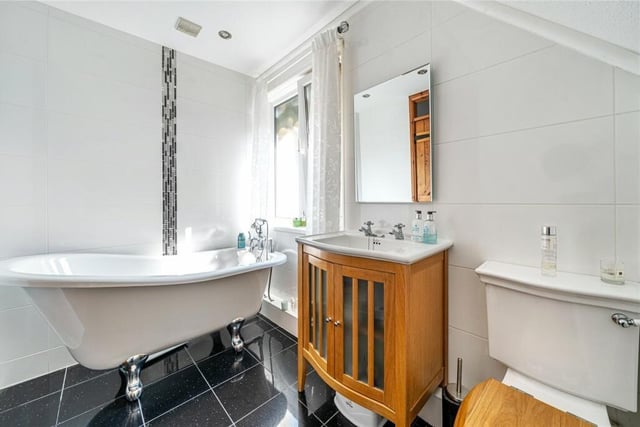 A claw-foot, free-standing bath forms part of the suite in the bathroom.