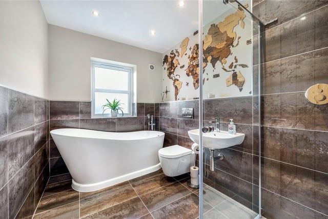 A fabulous bathroom, with free standing bathtub and walk-in shower.