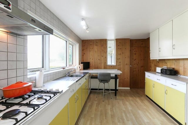 The breakfast kitchen has a built-in double oven with hob, and plenty of natural light from windows that overlook the garden.