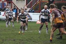 Connor Jones gets a pass away in Featherstone Rovers' narrow defeat at Batley Bulldogs. Picture: Rob Hare