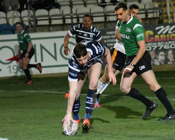Riley Dean scores a try during his loan spell with Featherstone Rovers. Picture: Rob Hare
