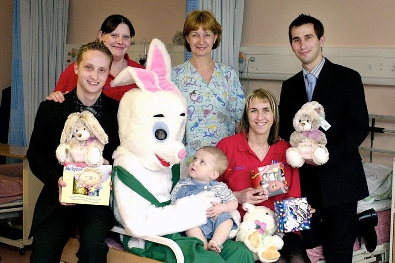 Easter eggs and cuddly rabbits are given to children at Pontefract General Infirmary. Pictured of 16 month old Bradley McNally with the Easter Bunny plus (L to R) Ben Farrer (YWNG), Leanne Olliman (Asda), Gillian Squires (Hospital Play Specialist), Lisa Waddle (Asda), James Windle (YWNG).