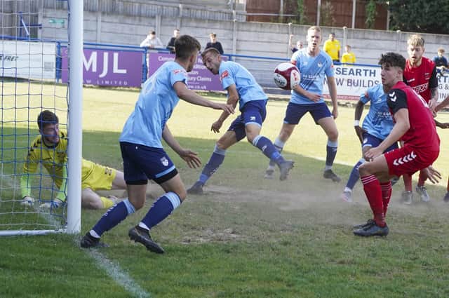 Goalmouth action sees Ossett United survive a scramble against Whitchurch Alport. Picture: Scott Merrylees
