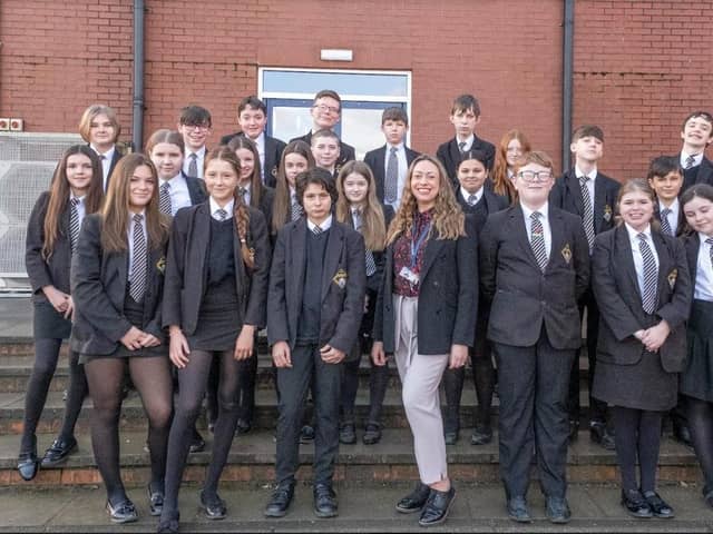 Sam Robinson with her form group 8SCR, who she says have been an 'absolute pleasure to teach and nurture' saying 'I will miss dearly.'
