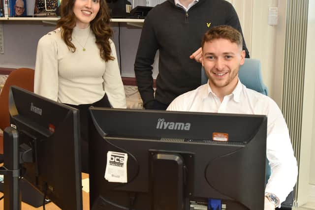 Lewis Bell, front, with apprentices Emily Chapman and Spencer Peck
