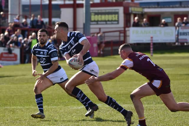 Craig Hall gets Featherstone Rovers moving in his rare half-back role at Batley. Picture: Rob Hare