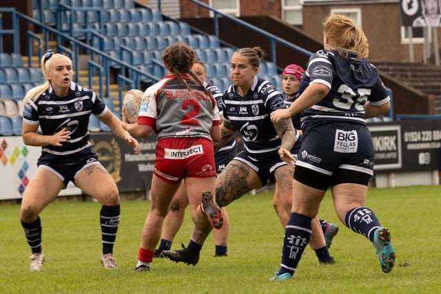 Featherstone Rovers Women show a strong defensive line.