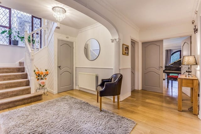 The hall to the home is incredibly spacious and features a generous cloakroom.