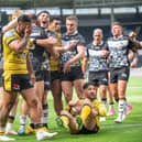Contrasting emotions as Castleford Tigers players are dejected while Carlos Tuimavave celebrates scoring Hull's second try. (Photo by Bruce Rollinson)