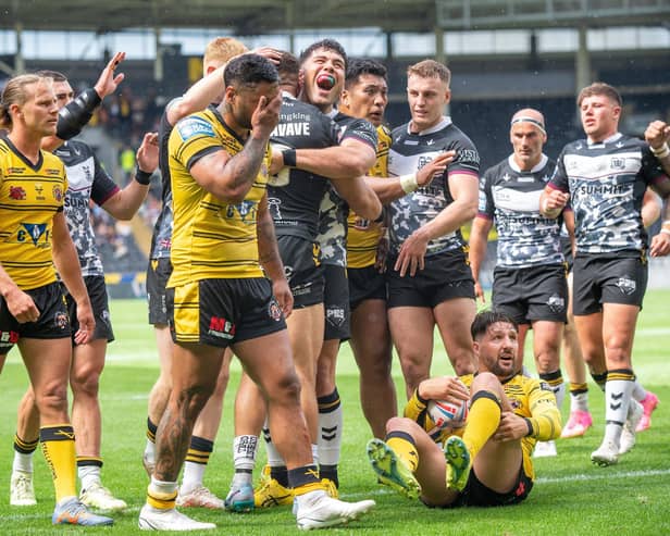 Contrasting emotions as Castleford Tigers players are dejected while Carlos Tuimavave celebrates scoring Hull's second try. (Photo by Bruce Rollinson)