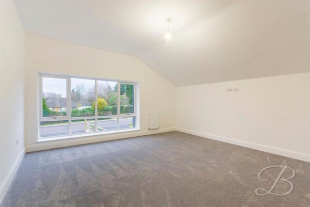 The master bedroom is full of natural light, thanks to wide windows overlooking the front of the £800,000 property. It boasts en suite facilities.