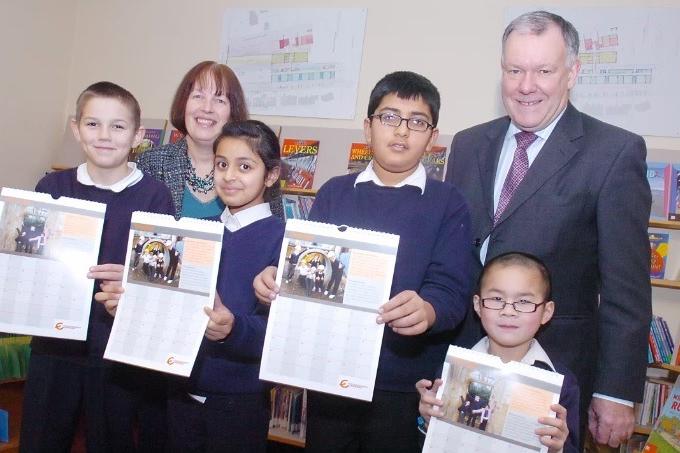 Sandal Magna J&I School headteacher Julia Simpson and MD Roger Perry with pupils in 2010.