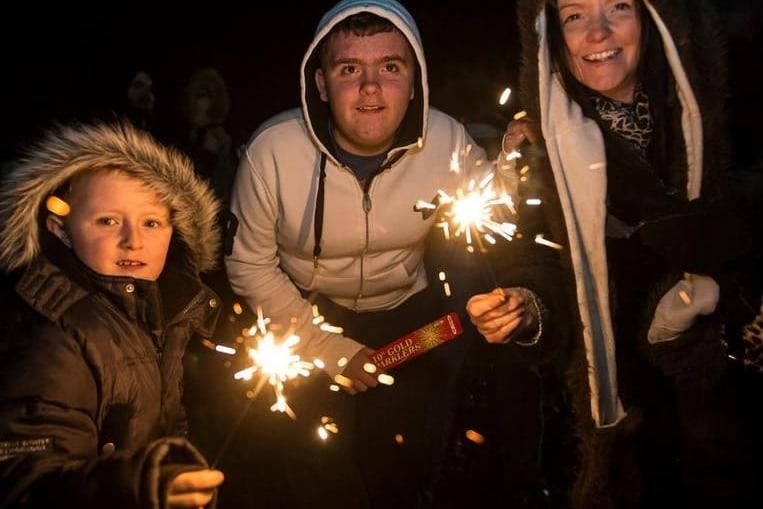 The Butterworth's Morgan, Cian & Lindsay enjoying a sparkler at Thornes Park in 2013.