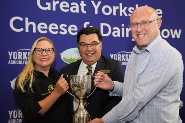 Clare and Richard Holmes accepting Award for Supreme Champion Cheese at the Great Yorkshire Show in 2019.