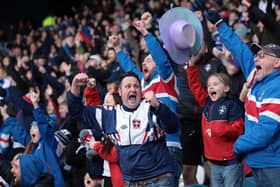 Jubilant Wakefield Trinity fans cheer their team on in the 2026 season. Picture: John Clifton Photography