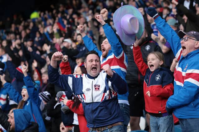 Jubilant Wakefield Trinity fans cheer their team on in the 2026 season. Picture: John Clifton Photography