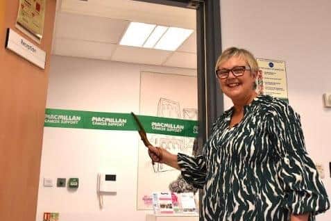 Tracey Strutt cutting the ribbon at the entrance to the new Macmillan Support Centre at Pontefract.