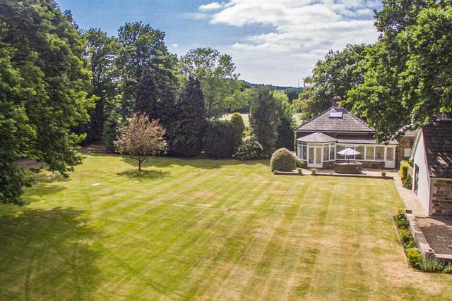 The expanse of lawn in the gardens stretches to boundaries with Kings Wood and Newmillerdam lake.