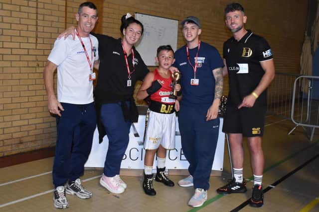 Bobby-James Francis with his coaches and Wakefield professional boxing star Dom Hunt after receiving a trophy following his amateur debut.