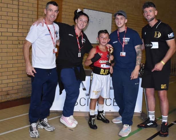 Bobby-James Francis with his coaches and Wakefield professional boxing star Dom Hunt after receiving a trophy following his amateur debut.