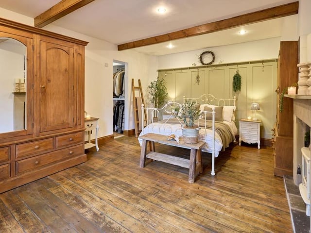 On the first floor is the master bedroom, which has its own walk-in wardrobe and en suite shower room.