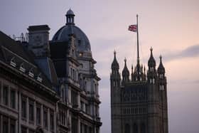 The Union flag is lowered at the Houses of Parliament following the death of Queen Elizabeth II (Photo by Dan Kitwood/Getty Images)
