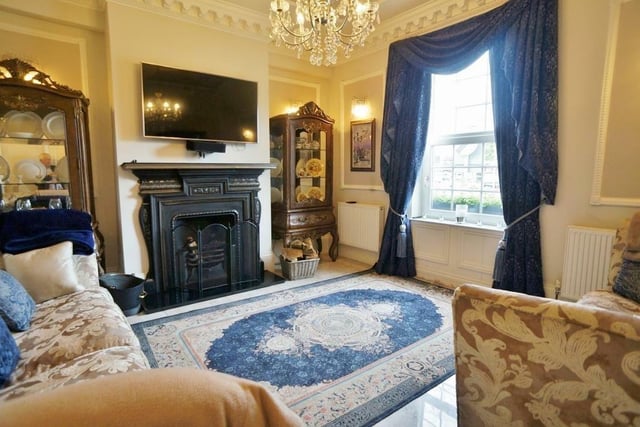 This beautiful room includes period features including deep cornice and ceiling relief, cast fireplace with open grate and a tiled hearth.