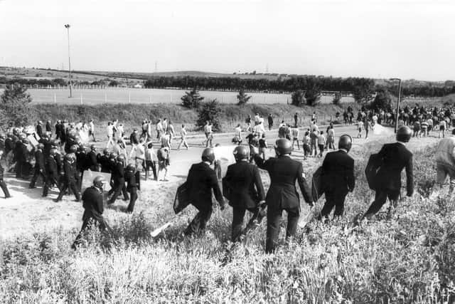 Police with riot gear move pickets at Orgreave coking plant, June 18, 1984