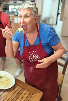 Karen enjoying the pasta she made after the cookery demonstration