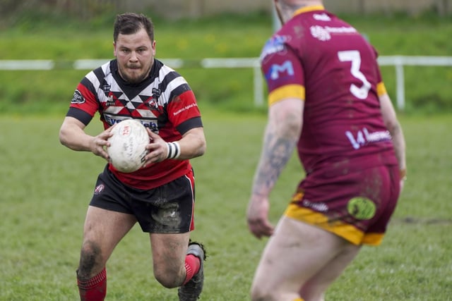 Connor Wilson takes on a Wigan St Judes tackler.