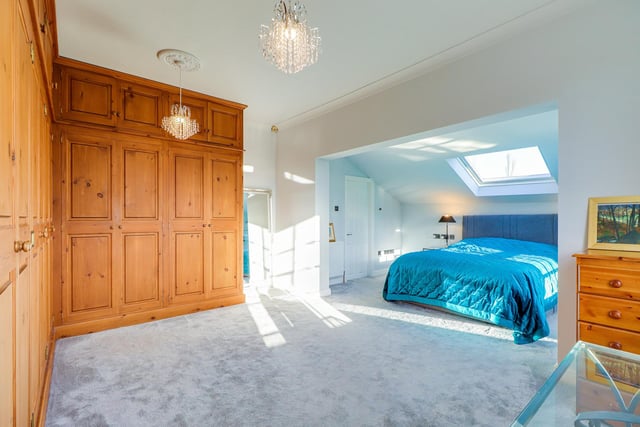 A spacious double bedroom with built-in wardrobes.