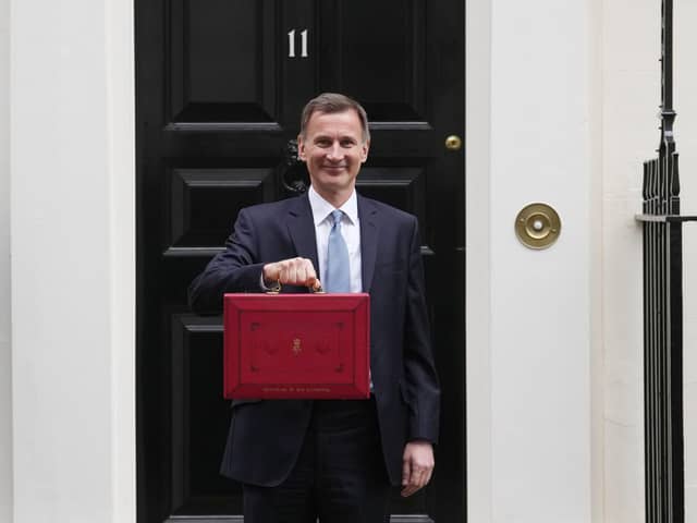 Chancellor Jeremy Hunt leaves Downing Street with the despatch box to present his spring budget to parliament on March 15. Photo: Getty Images