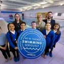 Councillors Michael Graham and Margaret Isherwood pictured with pupils and staff from Ash Grove Primary, South Elmsall, following the launch of Wakefield Council's new school swimming charter.