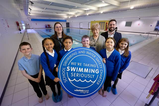 Councillors Michael Graham and Margaret Isherwood pictured with pupils and staff from Ash Grove Primary, South Elmsall, following the launch of Wakefield Council's new school swimming charter.