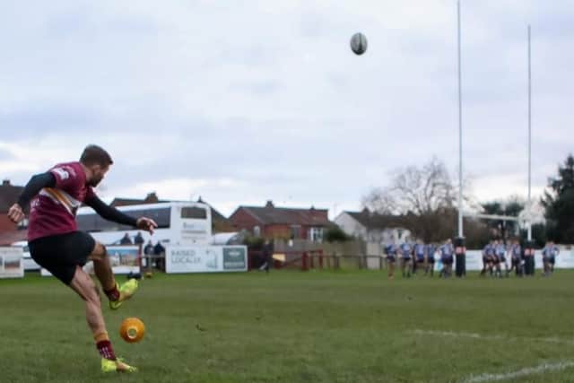 Tom Hodson lands a touchline goal for Sandal. Picture: Simon Hall