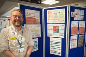 Dr David Aaron showcasing Navigating Suicide Prevention resources at the Trust Quality Conference.