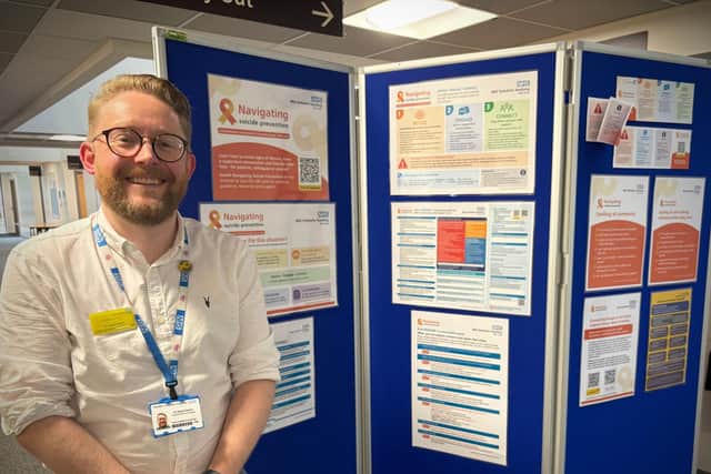 Dr David Aaron showcasing Navigating Suicide Prevention resources at the Trust Quality Conference.