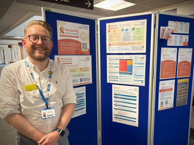Dr David Aaron showcasing Navigating Suicide Prevention resources at the Trust Quality Conference.