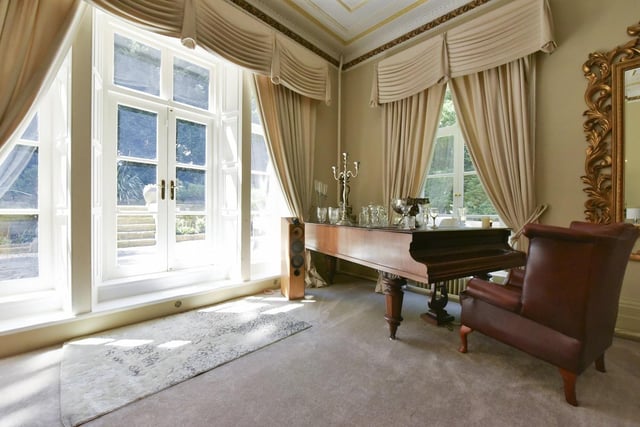 A place to tinkle the ivories, and patio doors out on to the terrace outside from this room within the Hall.