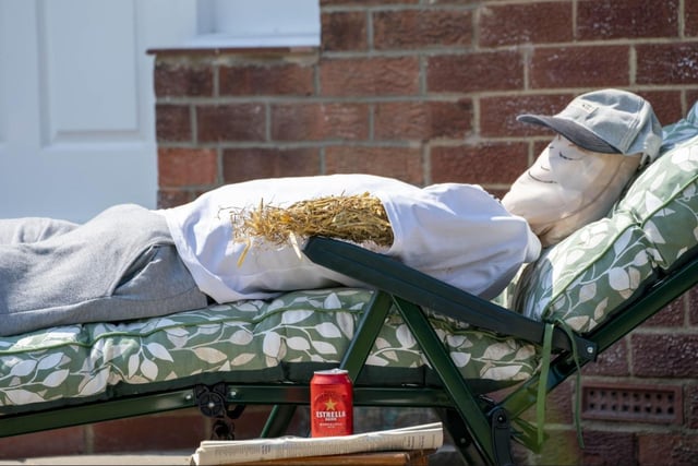 This scarecrow was making the most of the sunshine.