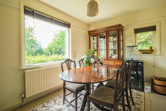 The breakfast room includes a storage cupboard containing central heating boiler and a double panel radiator.