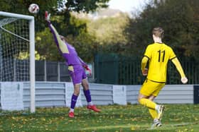 Ollerton Town's goalkeeper makes a flying save to keep out Nostell MW.