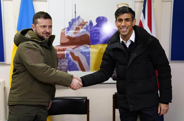 LULWORTH, UNITED KINGDOM - FEBRUARY 8: Prime Minister Rishi Sunak and Ukrainian President Volodymyr Zelensky meet Ukrainian troops being trained to command Challenger 2 tanks at a military facility on February 8, 2023 in Lulworth, Dorset, England. The Ukrainian President makes a surprise visit to the UK today in his second visit outside Ukraine since the Russian invasion nearly a year ago. The UK will offer further support in the form of training, equipment, and Russian sanctions. (Photo by Andrew Matthews/WPA Pool/Getty Images)