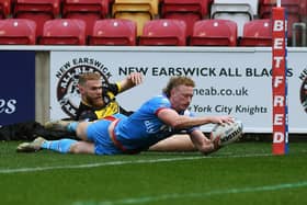 Lachlan Walmsley scores a try for Wakefield against York in the 1895 Cup