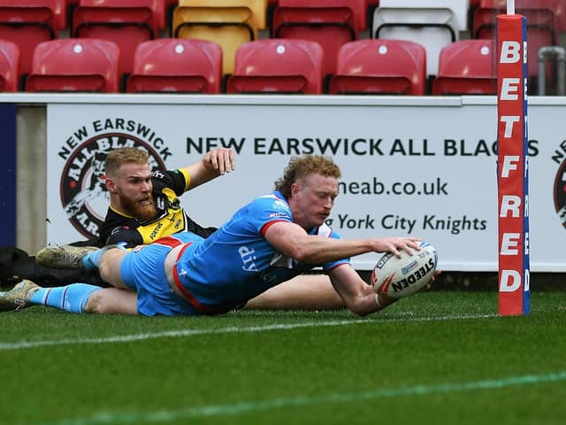 Lachlan Walmsley scores a try for Wakefield against York in the 1895 Cup