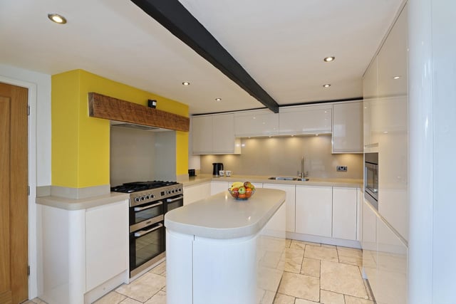 The modern fitted kitchen with central island.