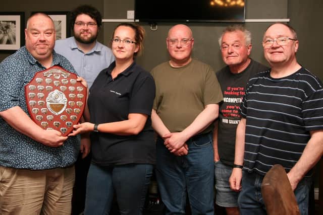 Division One champions Lofthouse Lions (from left) David Bill (captain), Evan Lynch, Sean Fisher, Peter Saxton, Andy Cook receive their trophy from Stacey Curtis, of Layers Cleaning.