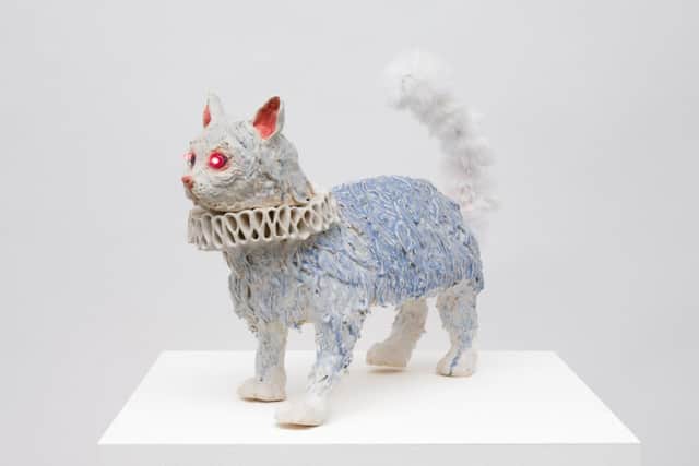 Lindsey Mendick's I Drink To You Isobel (2022), statuette of a cat wearing a ruff.